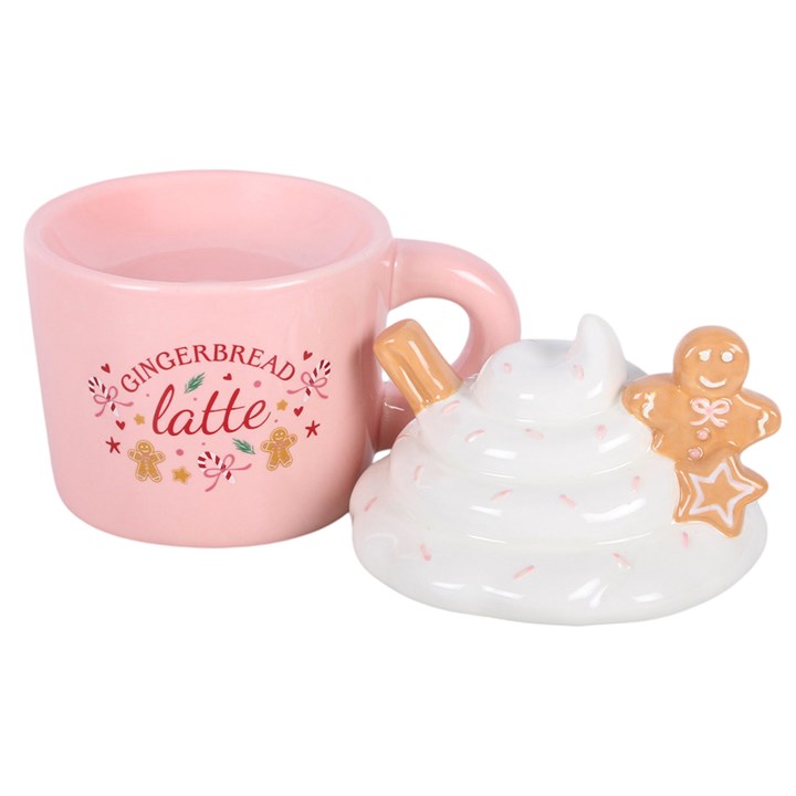 Detalle de quemador de wax melts taza navideña de jengibre, acabado artesanal, ambiente cálido y acogedor de hogar en Navidad