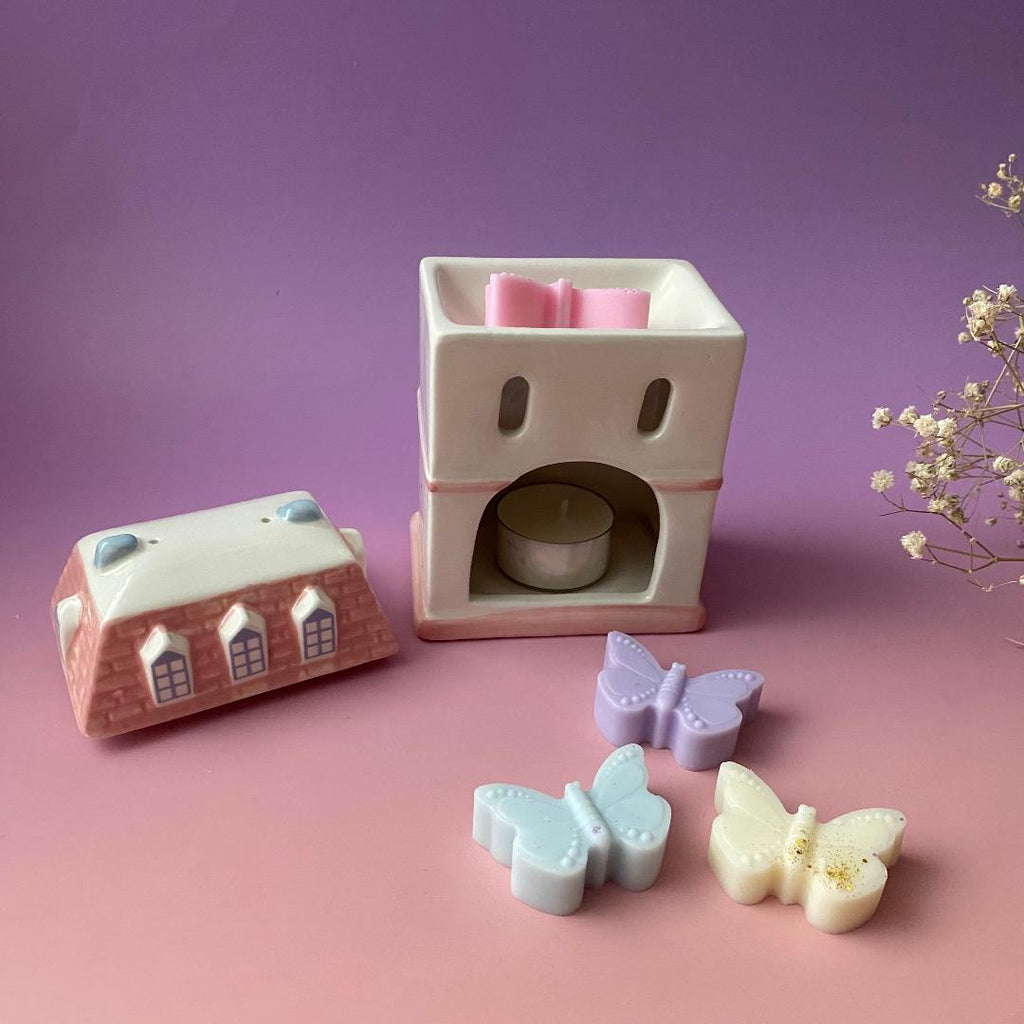 Quemador casita con wax melts mariposa