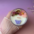 Vela aromática de coco y cítricos en vaso holográfico