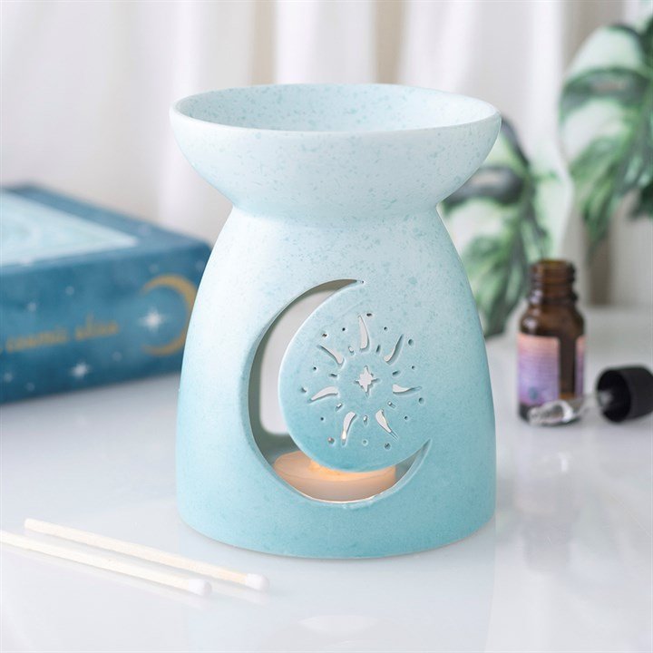Quemador de wax melts Blue Moon, diseño artesanal inspirado en la luna en tonos azules, vista frontal sobre fondo claro