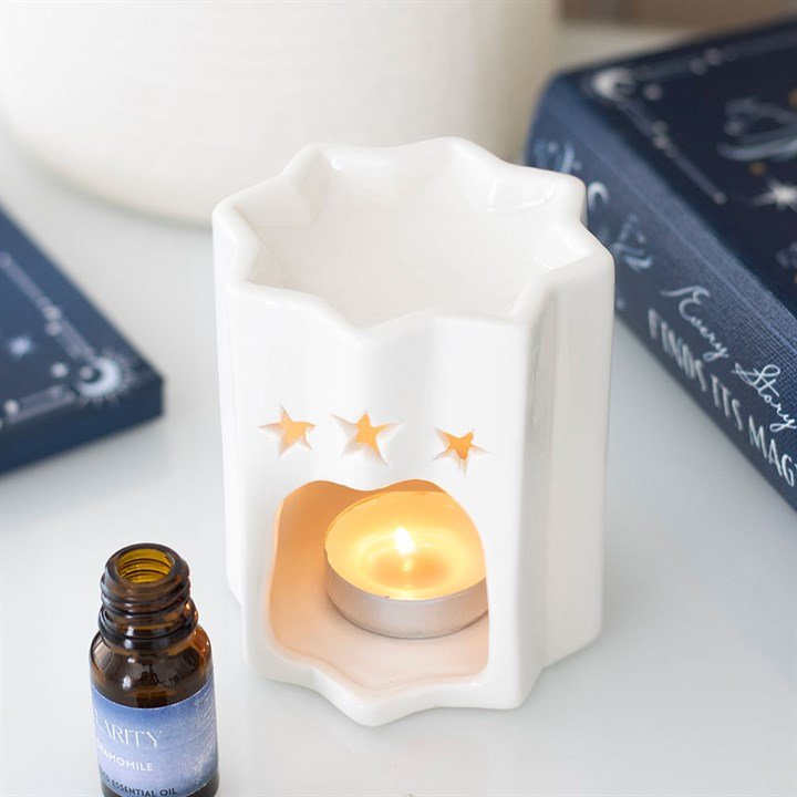 Quemador de wax melts artesanal de tamaño pequeño con diseño de estrellas, ideal para espacios íntimos