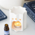 Quemador de wax melts artesanal de tamaño pequeño con diseño de estrellas, ideal para espacios íntimos
