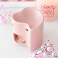 Quemador de wax melts artesanal en forma de corazón rosa, ideal para aromatizar el hogar