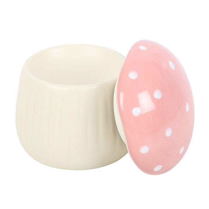 Quemador de wax melts setita rosa con la tapa superior abierta, mostrando la cavidad interior donde se coloca el wax melt