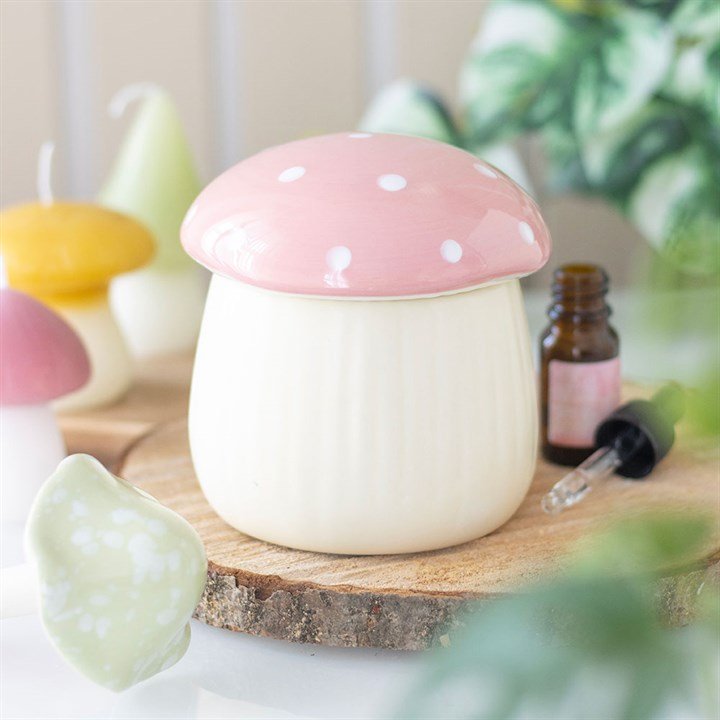 Quemador de wax melts con forma de setita rosa, vista frontal sobre fondo claro, diseño artesanal decorativo