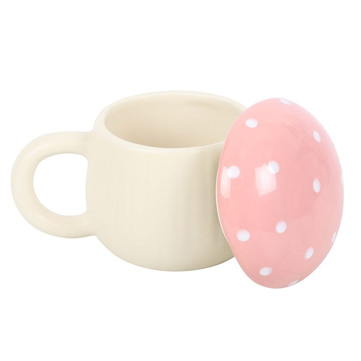 Detalle de taza seta rosa con vela aromática de arándanos, pera y bellini, acabado artesanal en tono rosado, regalo especial y único